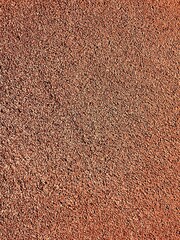 Carpet texture background. Running track rubber cover. Texture of soft velour with dense pile close-up. Colored background. Close-up photo of clean bath towels. Abstract image. Red background
