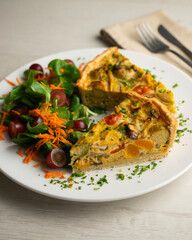 French quiche with fall vegetables such as brussels sprouts, sweet potato, and mushrooms.