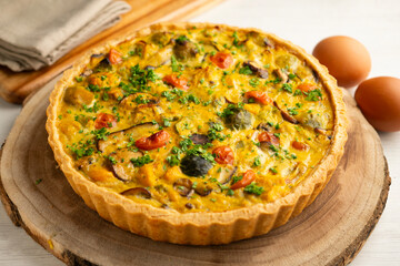 French quiche with fall vegetables such as brussels sprouts, sweet potato, and mushrooms.
