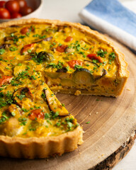 French quiche with fall vegetables such as brussels sprouts, sweet potato, and mushrooms.