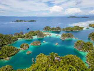 Raja Ampat, Indonesia: Aerial view of the Piaynemo viewpoint famous for its limestone karst landscape in Raja Ampat archipelago in West Papua in Indonesia.
