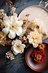 Beautiful floral arrangement and ceramic tableware for table setting