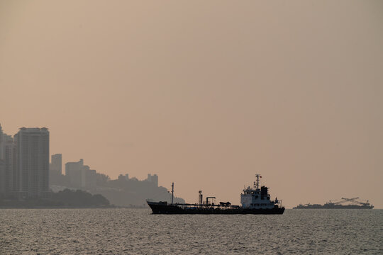 PENANG, MALAYSIA - APRIL 10, 2023: The SJW Gold Line is a chemical tanker vessel sailing on the open sea.