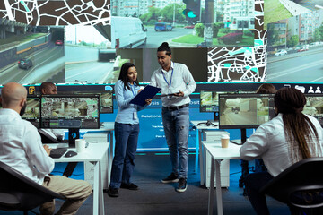 Indian team of operators instructing their colleagues to use CCTV surveillance footage and guide...