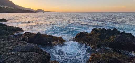 rocky shore and beautiful sunset in tenerife 