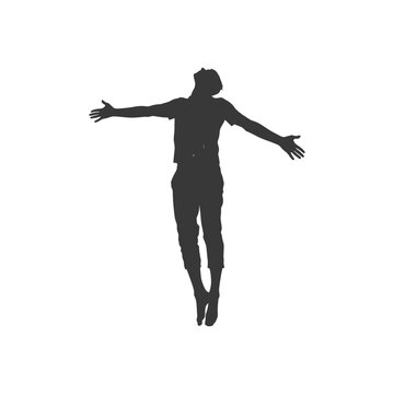 Silhouette of a Man Jumping with Arms Open, Back Lit.