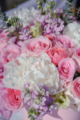 Mixed flowers of different shades of pink in a floral wedding decoration.  Floral background.
pink roses