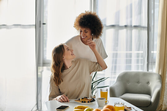 Two women enjoying a casual moment together in their home.