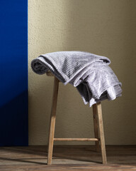 plaid on a chair in a living space on the background