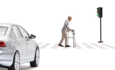Full length profile shot of an elderly man with a walker at a pedestrian crossing