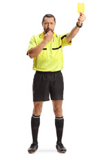 Football referee showing a yellow card and blowing a whistle