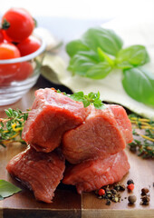 fresh raw meat on a wooden board