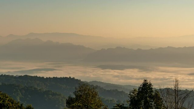 Tropical forest nature landscape view with mountain range sunrise with moving cloud mist at Huai Nam Dang National Park, Chiang Mai Thailand
