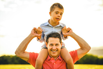 Nice father and child Playing on great field at Sunset