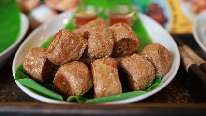 Close-up of food for sale in the market, Pork belly crispy on a wooden chopping board