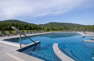 Outdoor hotel swimming pool in the summer
