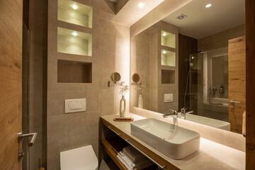 Luxury bathroom interior with large mirror