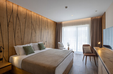Interior of a hotel apartment with large master bed