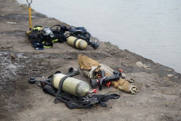 Fire extinguisher equipment of firefighters extinguishing fire Firefighters in smoke pour burning...