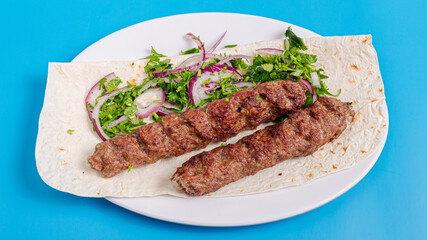 Lula kebab on plate top view