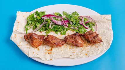 Lamb kebab on plate top view