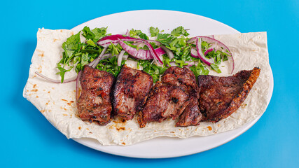 Beef kebab on plate top view