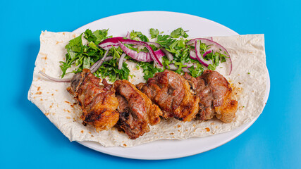 Lamb kebab on plate top view