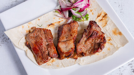 Lamb kebab on plate top view