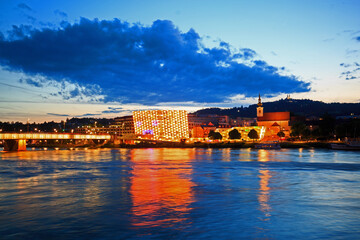 Vienna on the River Danube with illuminated buildings reflecting in the water
