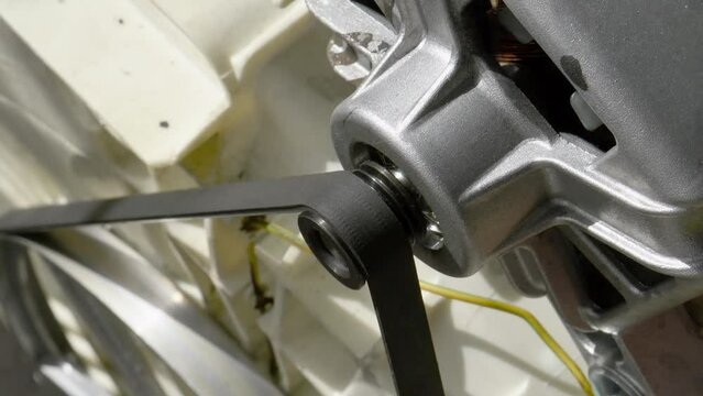 Close-up video of a washing machine electrometer with drive belt.