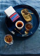 herbal hot tea with cups on the shelf