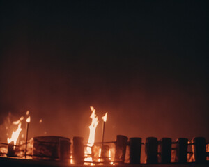 Out of focus background with fire behind fence on night background. Generative AI