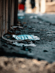 Disposable mask left on ground