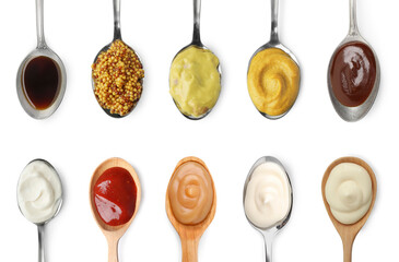 Set of different sauces in spoons isolated on white, top view