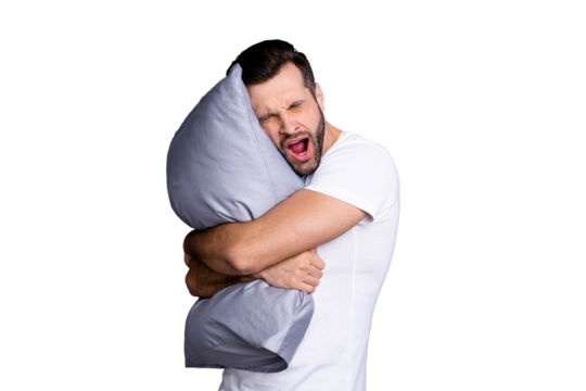 Portrait of his he nice-looking attractive bored tired sleepy bearded guy having rest chill out holding in hands pillow isolated over gray pastel violet purple background