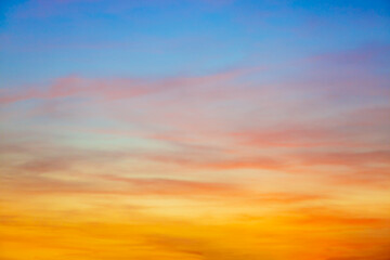 Clouds and sky in the evening,Real majestic sunrise sundown sky background with gentle colorful clouds without birds. Panoramic, big size