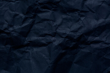 Black paper texture,Black crumpled paper texture in low light background