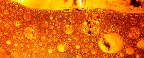 Yellow drink bubble texture close-up,Beer Background Ice Cold Pint With Water Drops Condensation,Golden yellow water drops. Nature collection.