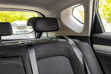 Car interior. Backseat of car. Car headrest. Soft focus
