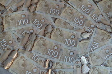 Canadian dollar bills spread on the table. 