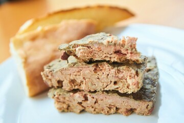 Meat pate on a white plate. Meat production