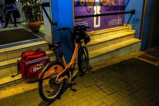Sao Paulo, Brazil, May 18, 2024. Motorcycle parked with a Styrofoam box for transporting food from the company ifood, on a street in downtown of Sao Paulo