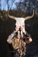 Viking warrior with sword, skull and battle bat