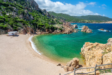 View of  Cala Li Cossi sandy beach, scenic cove in the mediterranean coast and sea with beautiful...