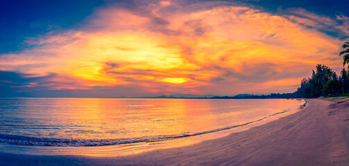 Landscapes of sunset on the beach with colorful sky background.