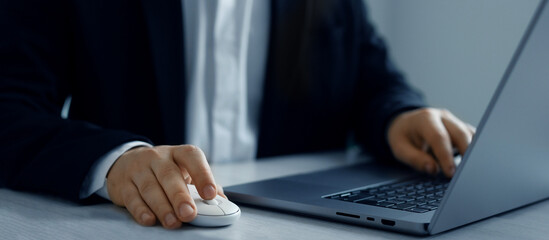 Obraz premium Businessman working on a laptop in the office.Concept of online communication, working, business and technology networking.