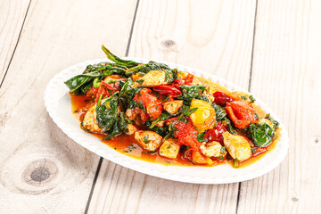 Chicken with tomato and spinach