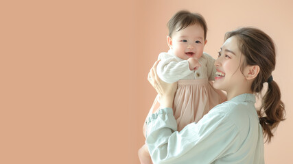 Korean mother holding her baby with her arm and lifting up playing fun
