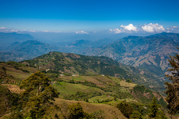 Naklejka premium Coffee cultural landscape. Beautiful mountains of the Central Ranges in the municipality of Aguadaslocated on the department of Caldas in Colombia.
