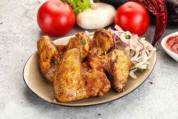 Grilled chicken wings with sauce
